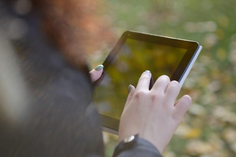 Woman working on a tablet free photo