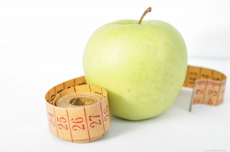 Apple with measuring tape free photo