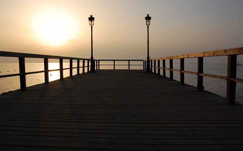 Deserted dock at sunset free photo