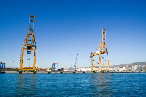 Large maritime cranes on docks free photo
