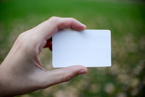 Man hand holding blank card free photo