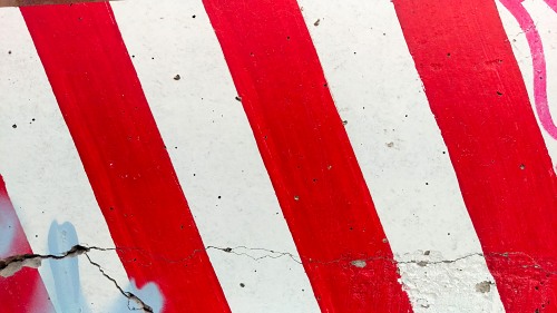 Red stripes marking on concrete block free photo