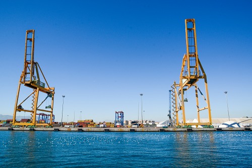 Shipping cranes on dock free photo