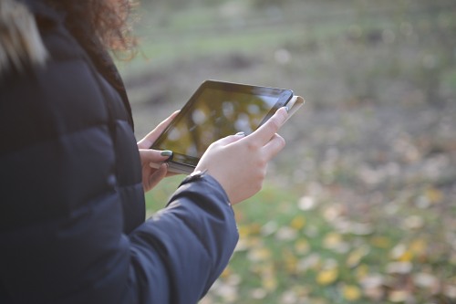 Woman using digital tablet free photo