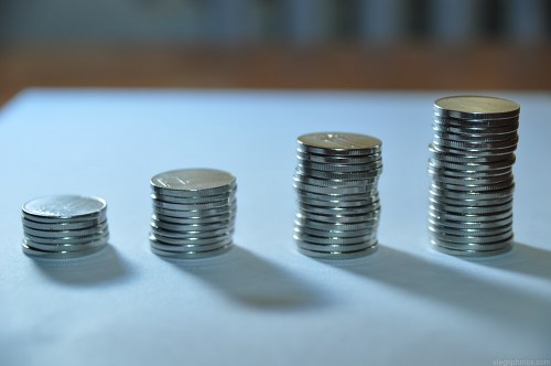 Coins stacked in an increasing pattern free photo