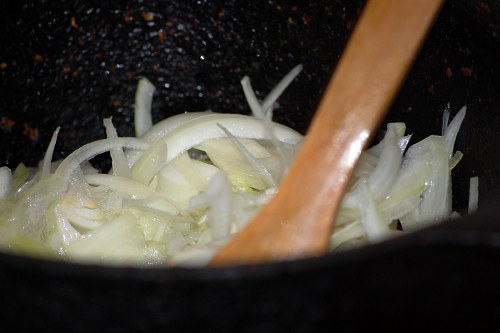 Cooking onion in a pot free photo