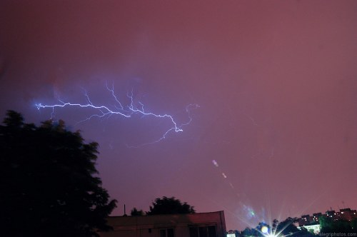 Lightning over city free photo
