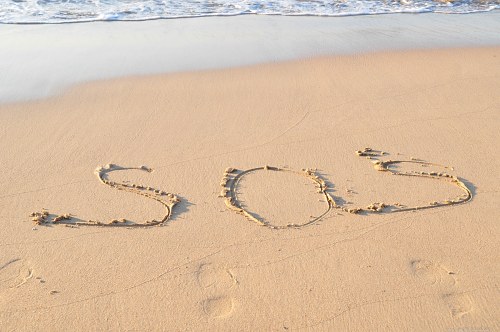 SOS on sand free photo